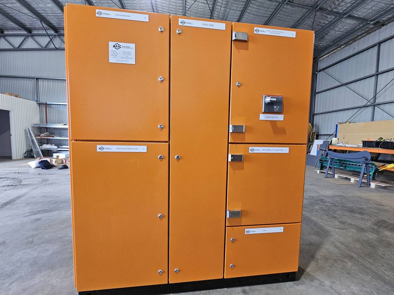 Large orange main switchboard built in the AMC workshop