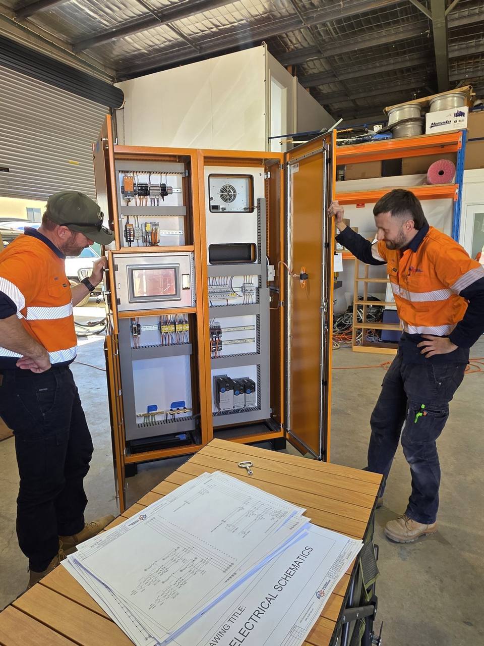 Control panel with HMI being reviewed by the AMC team