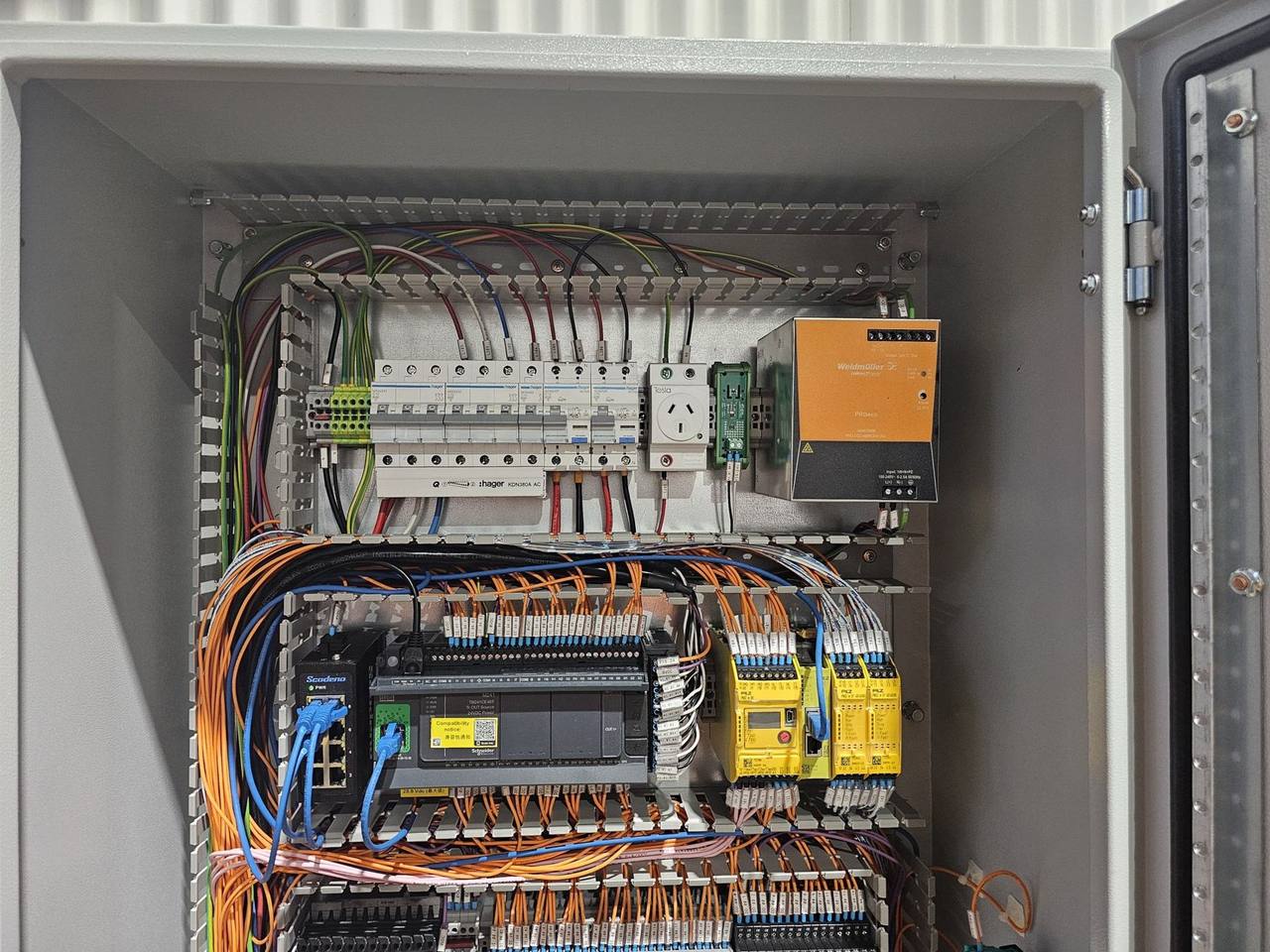 PLC control board with safety relays and terminal wiring