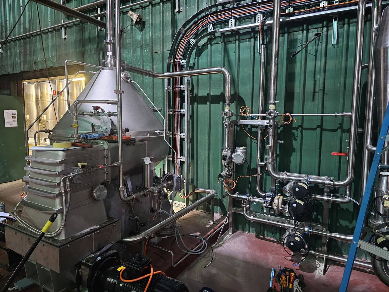 Process plant with stainless pipework and centrifuge