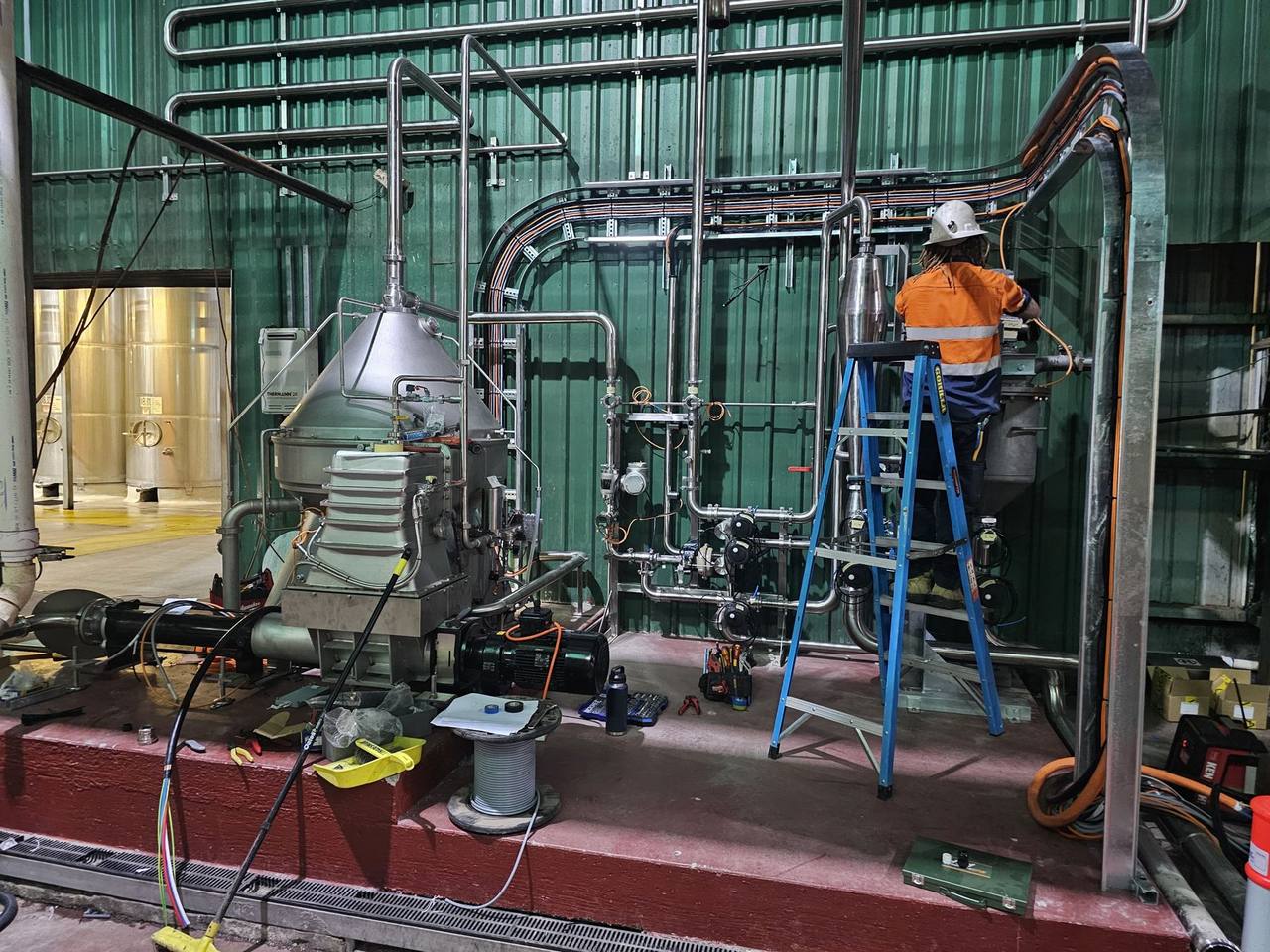 AMC electrician installing cabling at a food processing plant