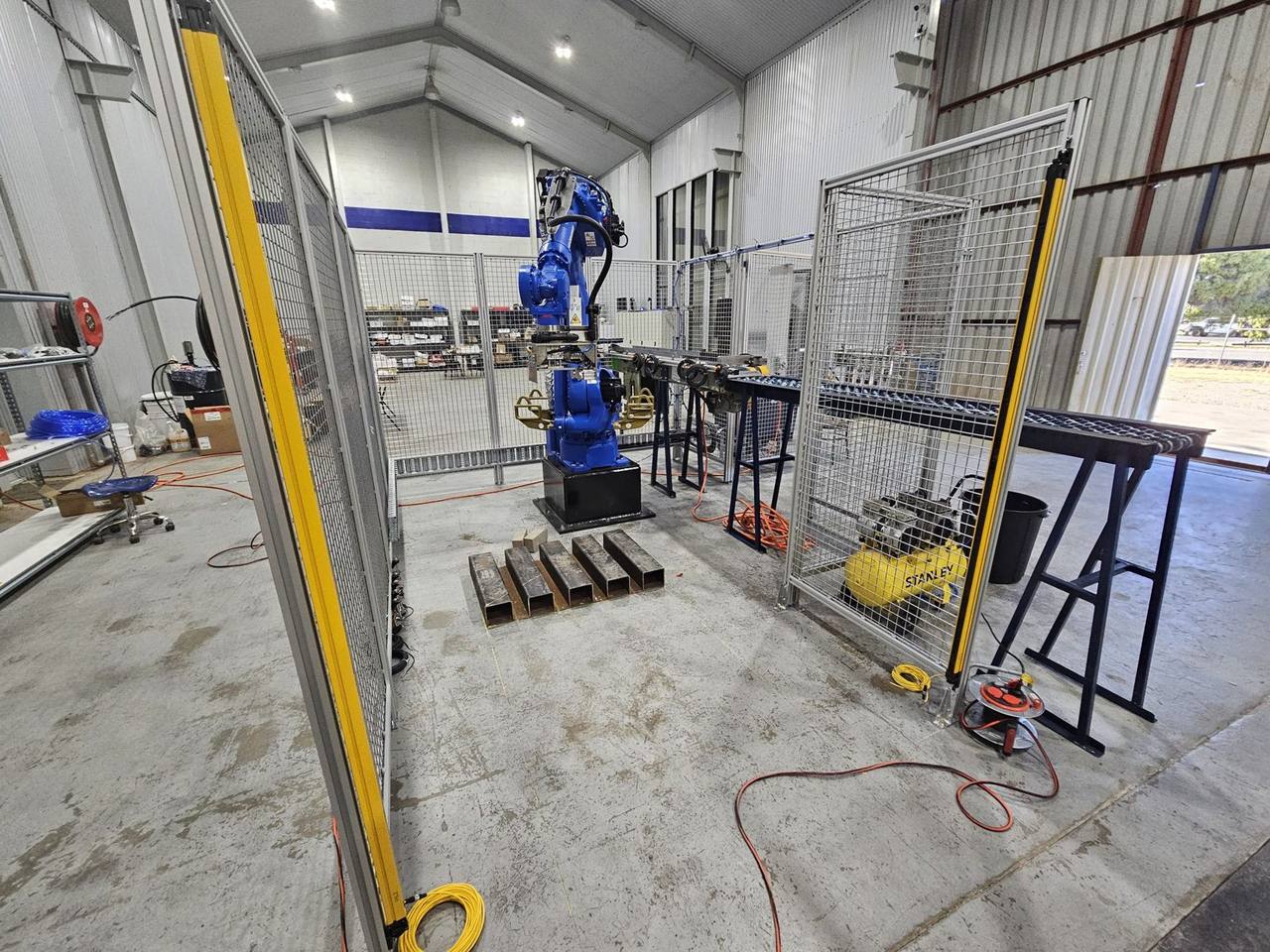 Industrial robot cell inside a guarded enclosure